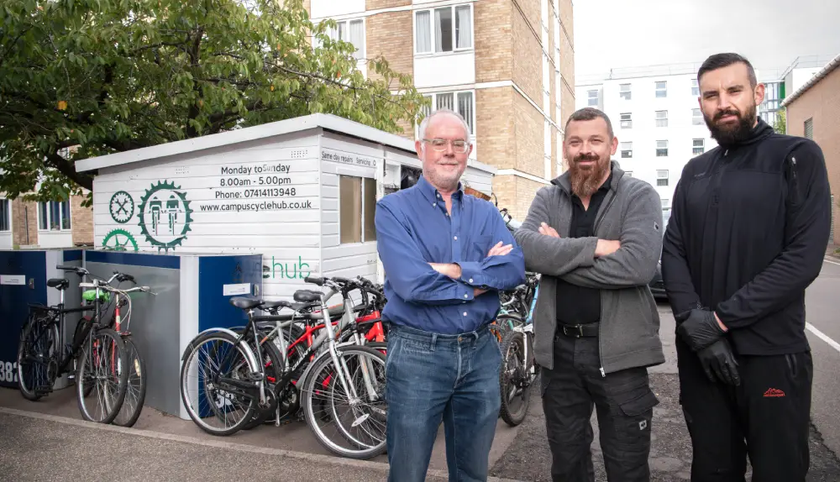 cycle hub colleagues stand outside cycle hub building