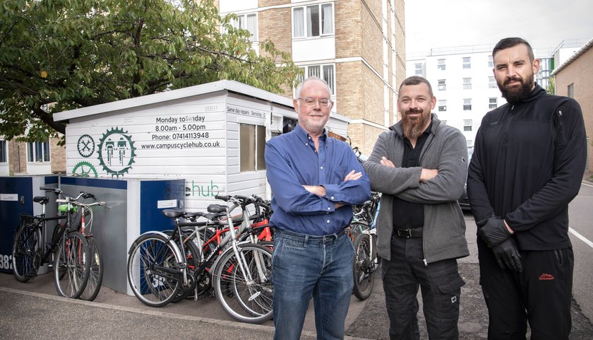 cycle hub colleagues stand outside cycle hub building