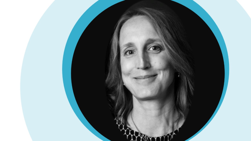 A graphic consisting of blue concentric circles around a black and white photograph of Kim.