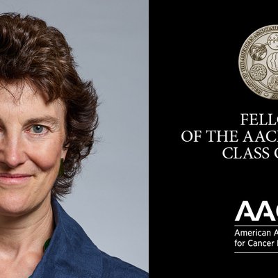 A lady next to a medal