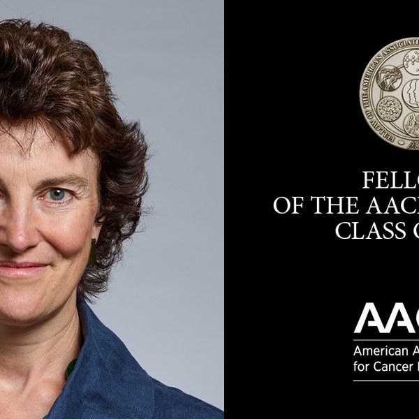 A lady next to a medal