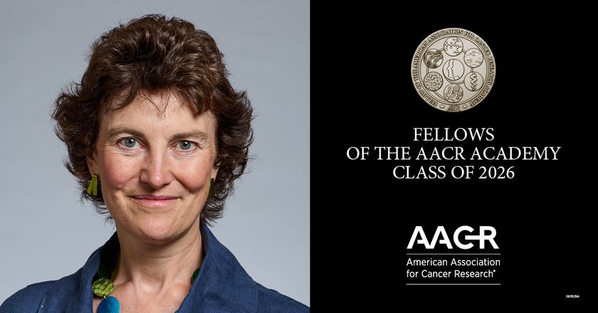 A lady next to a medal