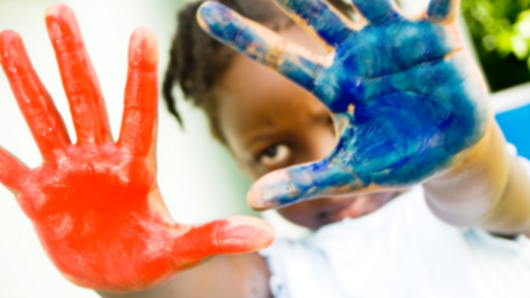Child with paint on their hands