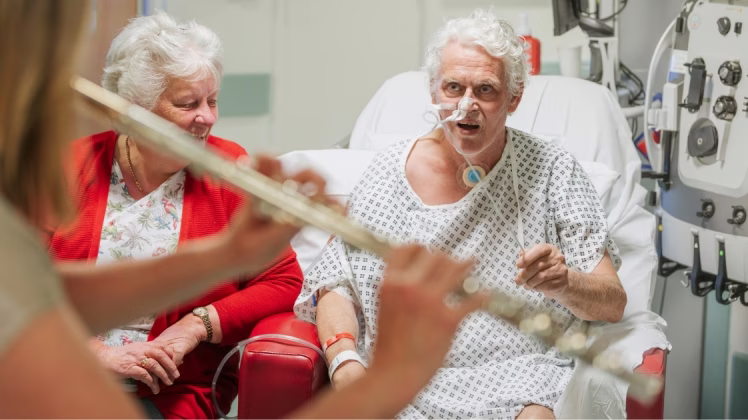 A patient conducts a musician on an ICU ward.