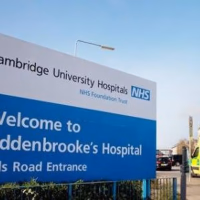 Addenbrooke's hospital sign on road leading up to the hospital.