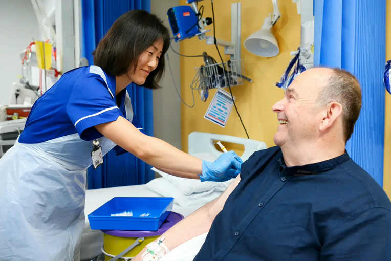 Nurse giving a patient a vaccine