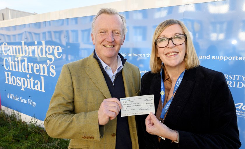 Cheffins chairman Bill King presenting £212,000 cheque for CCH to Shelly Thake, Chief Executive at Addenbrooke's Charitable Trust