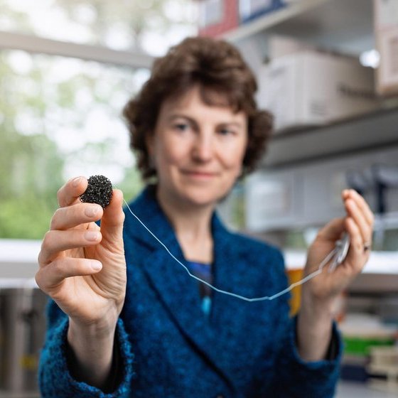 Rebecca Fitzgerald holding the cytosponge in front of her
