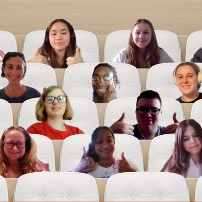 A group of young people and adults doing a thumbs up in an online meeting.