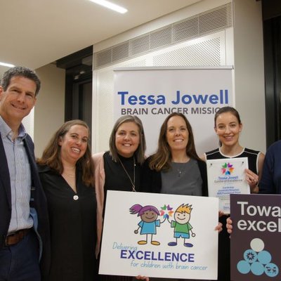 A group of clinical staff holding certificates of excellence