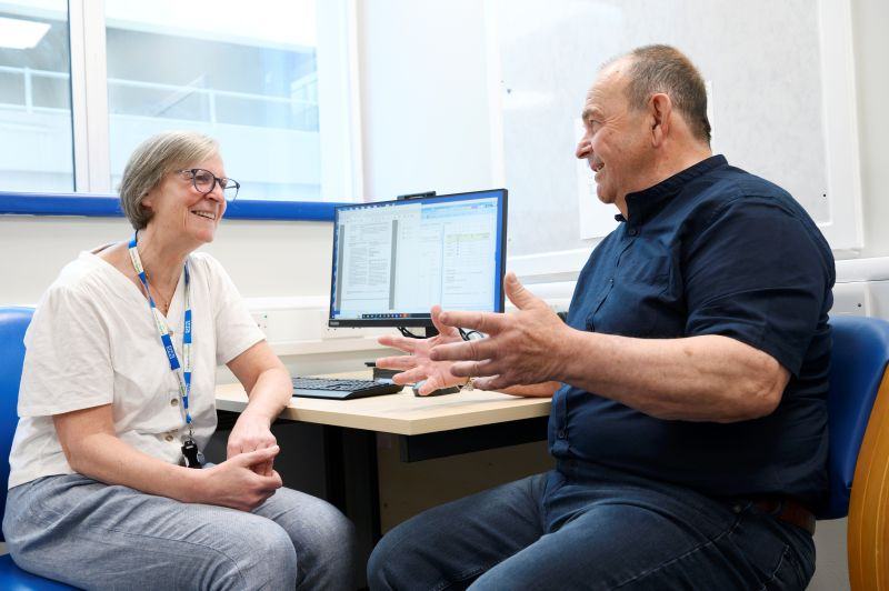 Consultant and patient discussing cancer vaccine trial