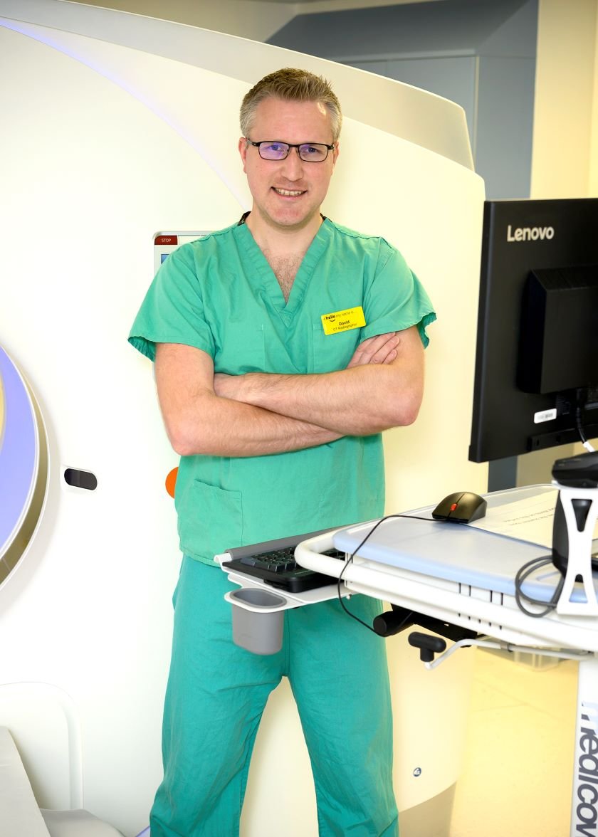 David Biddle in green scrubs