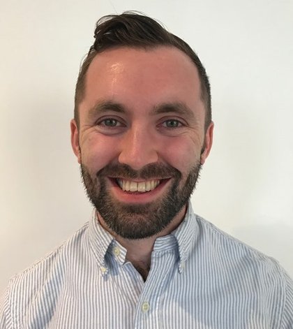 Head shot of Dr William Dunn smiling at the camera