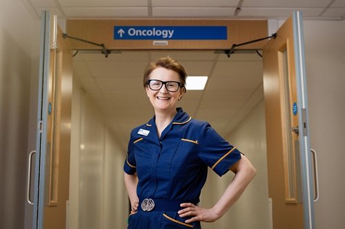 A photo of a nurse outside a ward