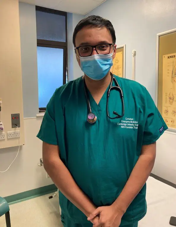 Emergency Department consultant in green scrubs