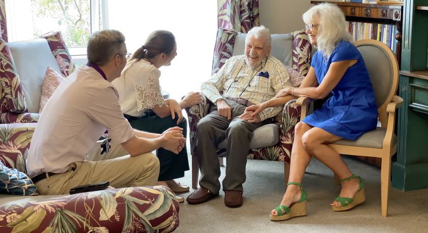 Addenbrooke's Hospital geriatricians speaking to one of the care home residents