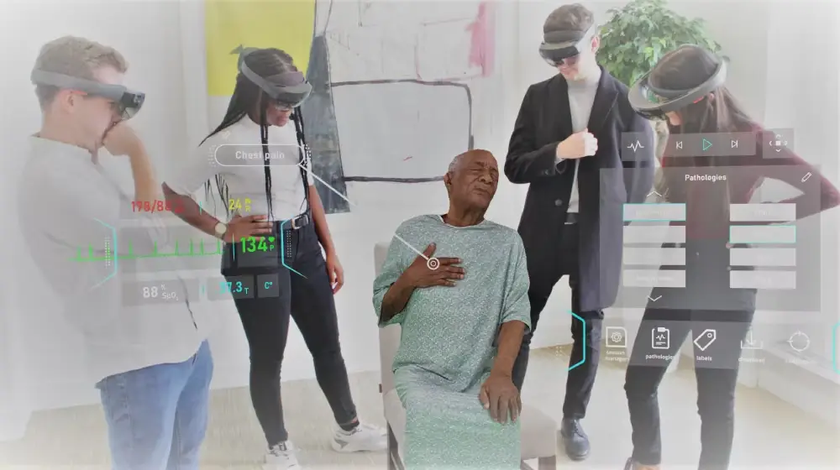 Hologram patient with people using VR headsets around him