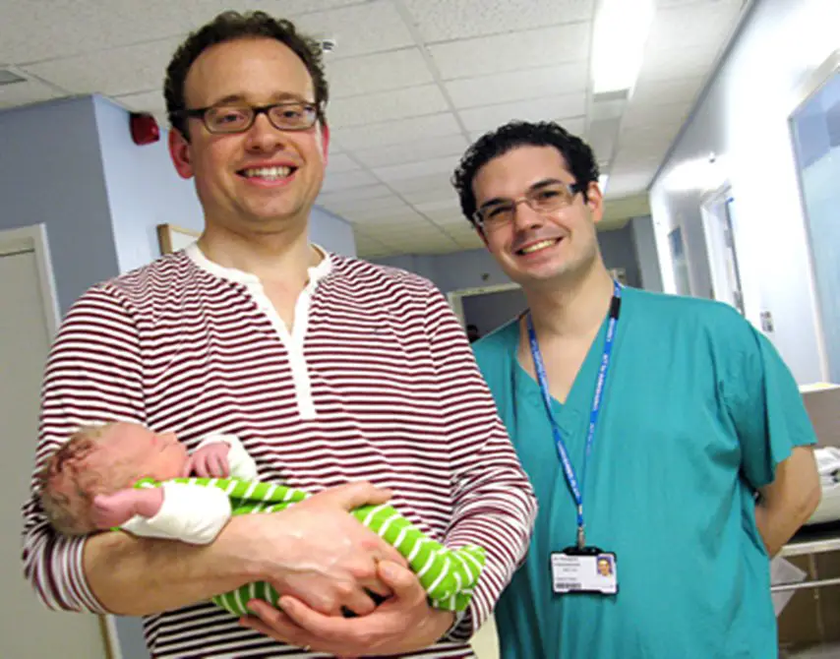 James Robinson with baby Frederick and Dr Panagiotis Giamougiannis