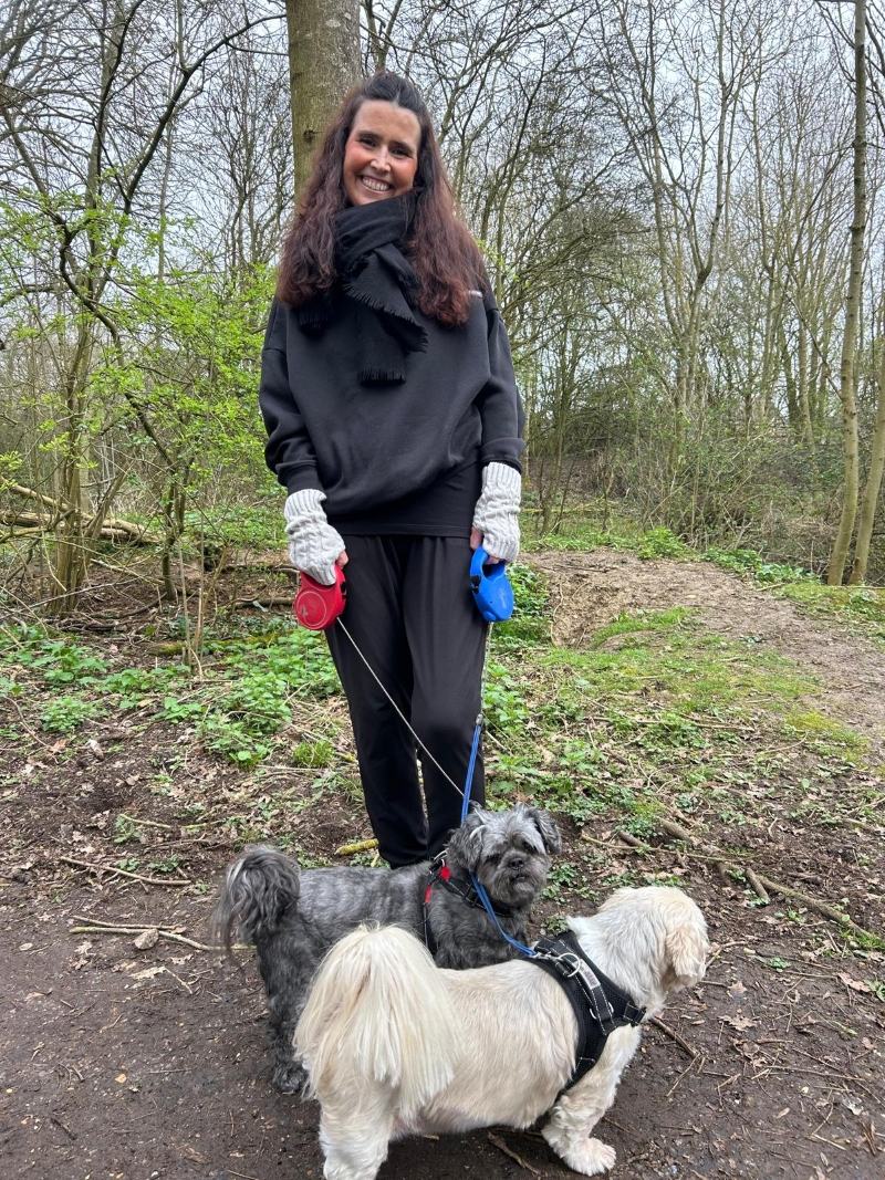 Robotic surgery patient Jane back walking her dogs following surgery