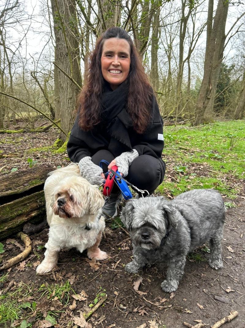 Robotic surgery patient Jane walking her dogs post surgery
