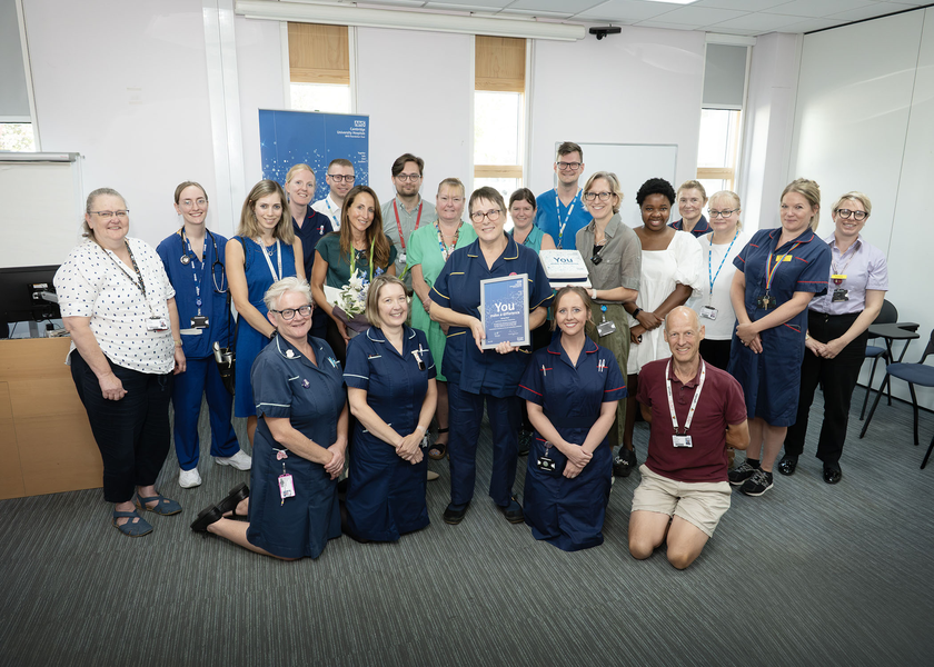 Jenny Pool with her colleagues as she recieves her award