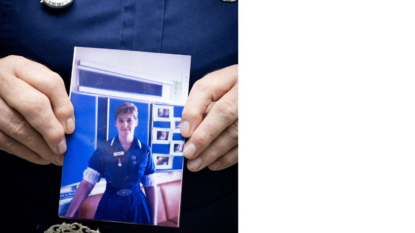 Karen Dunling holding a picture of herself from earlier in her career