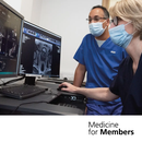 Raj Jena and colleague looking at MRI scans on a computer. Text reads 'medicine for members'