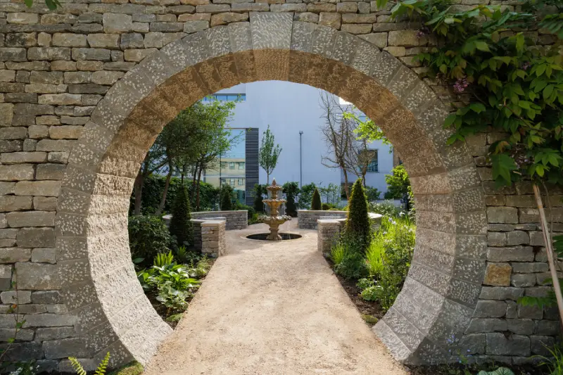 A photo of the moongate in the Bridgerton Garden
