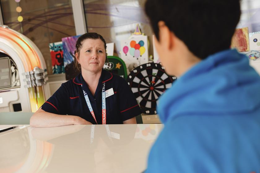 Staff and patient talking