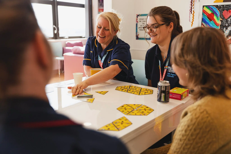 Staff members talking together