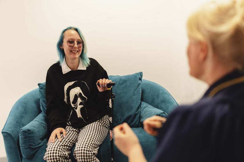 A patient talking with staff