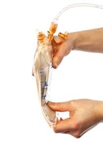 a clear laboratory separation funnel with blue measurement markings. The funnel contains a small amount of red liquid at the pointed bottom and is fitted with amber-colored stopcocks and clear tubing at the top