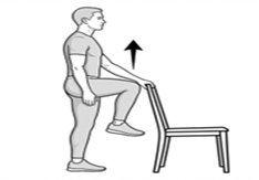 Standing knee raise exercise using a chair for balance, lifting one knee toward hip height.
