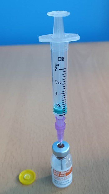 Needle inserted in to solu-cortef