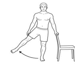 Person standing beside a chair for support, performing a side leg raise by moving one leg out to the side while keeping the body upright.
