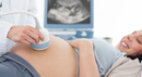 Pregnant women undergoing an ultrasound scan