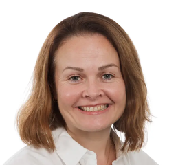 Sarah Wallwork - she has short brunette hair and wears a green and black leopard-print top and NHS blue and white lanyard