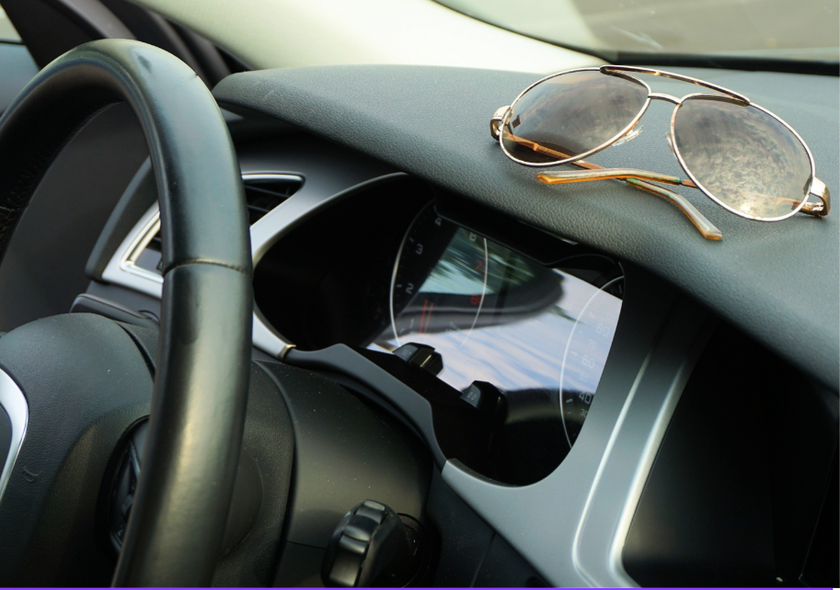 Car steering wheel in the sunshine