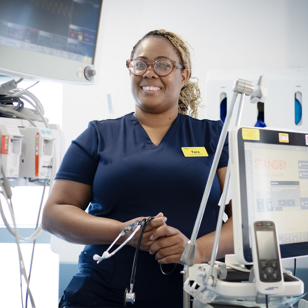 Tara Walters in a medical setting surrounded by medical equipment and screens