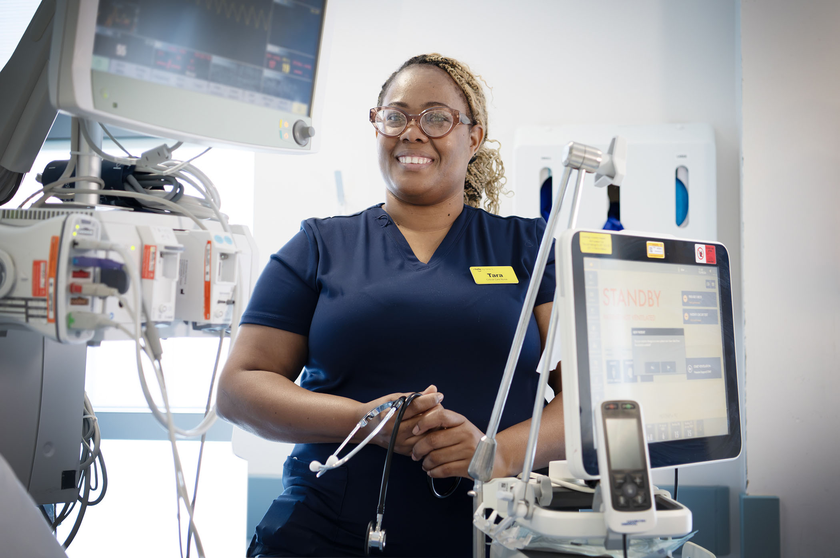 Tara Walters in a medical setting surrounded by medical equipment and screens