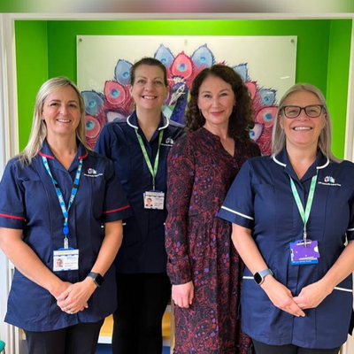 The community asthma team of four practitioners are pictured together facing the camera