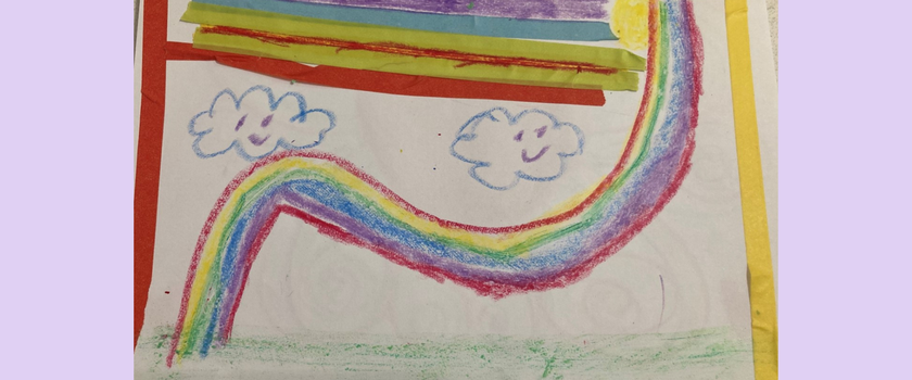 A child's crayon drawing of a rainbow with clouds