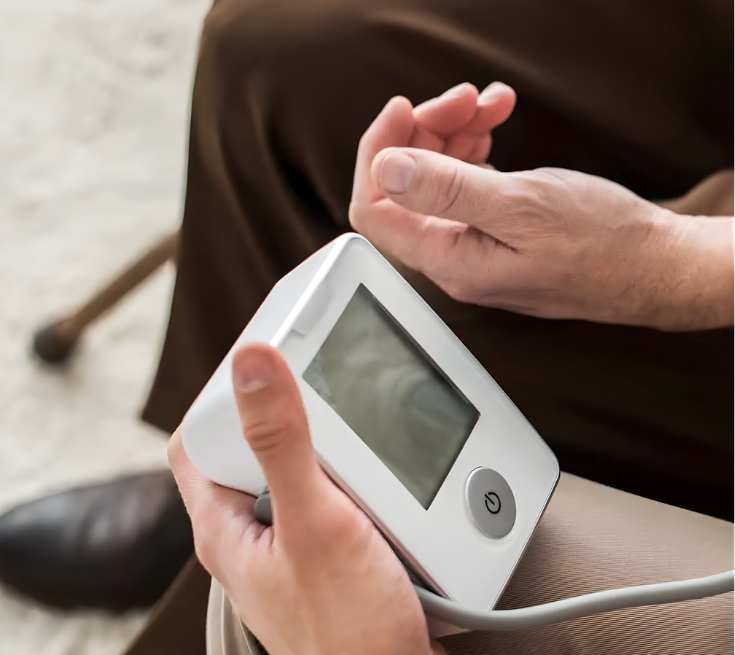An elderly man getting his blood pressure tested