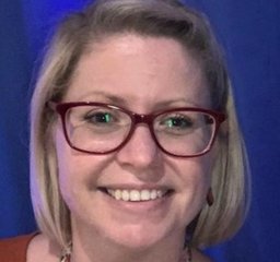 Dr Amy Shayle - she has blonde shoulder-length hair and wears glasses
