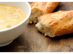 Image of some baguette and a bowl of soup