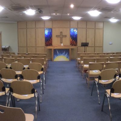 Rows of chairs looking towards the altar in our chapel