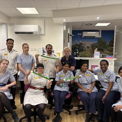A photo of a group of nurses and healthcare workers holding reusable tourniquets