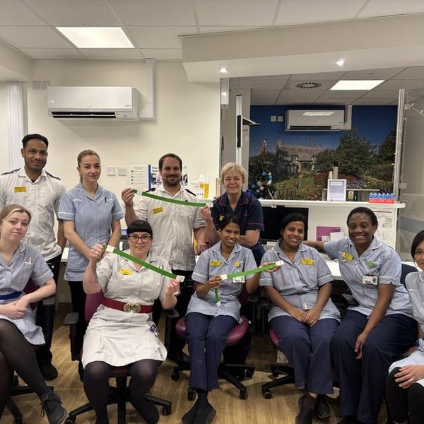 A photo of a group of nurses and healthcare workers holding reusable tourniquets