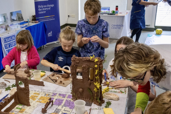 Children making a clay hospital