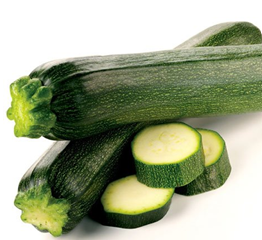 Image of two whole courgettes and three slices of courgettes